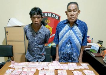 Dua orang terduga sebagai pelaku tinda pidana pencurian uang senilai Rp 60 juta.