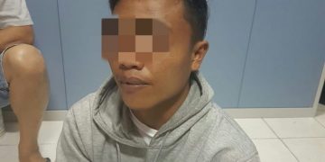 RD (21), salah satu tersangka penganiayaan terhadap Reykel Hanafi, warga Desa Mongolato Kecamatan Telaga Kabupaten Gorontalo.