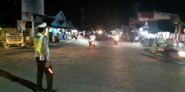 Sosialisasi dan penutupan jalan oleh Lantas Polres Gorontalo Utara bersama Polsek Kwandang