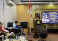 Ketua Pengadilan Negeri/Tipikor/PHI Kelas IA Gorontalo, Yusuf Syamsuddin, memberikan sambutan pada penandatanganan Perjanjian Kerja Sama (PKS) antara Komisi Pemberantasan Korupsi (KPK) dan Pengadilan Negeri Gorontalo terkait perekaman persidangan tindak pidana korupsi, di Smart Room Universitas Gorontalo, Selasa (7/7/2026). Kegiatan tersebut dirangkaikan dengan kuliah umum bertema Reformasi Penegakan Hukum Tindak Pidana Korupsi dalam Perspektif KUHP dan KUHAP Baru. (Foto: Humas PN Gorontalo)