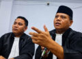 Ronald Van Mansur Nur, S.H., M.H., CPCLE, bersama Fanly Katili, SPd, SH, MH (mengenakan kopiah)